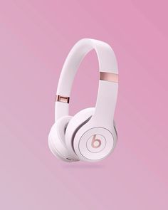 the beats on ear headphones are white and gold