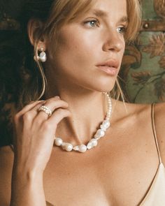 Redefine expectations with our feminine Genova pearl earrings. Combining classic with a touch of something more unique - this bold duo is what we call a modern heirloom. Hair up or down - the Genova earrings will perfectly accentuate your every look. 

Break the mould & pair with the Champagne Necklace to prove once again that beauty is so much more than perfection. 
Details

Handcrafted in a thick layer of 18k gold on sterling silver2 genuine 11-13 mm freshwater baroque drop pearls & 4 mm keshi Modern Pearl White Jewelry With Pearl Drop, Everyday Elegance Teardrop Pearl Drop Jewelry, Classic Pearl White Pear-shaped Jewelry, Teardrop Pearl Drop Jewelry For Everyday Elegance, Teardrop Pearl Drop Jewelry For Evening, Classic Teardrop Baroque Pearl Necklace, Evening Teardrop Pearl Drop Jewelry, Feminine Teardrop Jewelry For Formal Occasions, Fine Jewelry Pearl Drop Necklace In Teardrop Shape