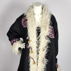 This kimono kaftan coat is completely handmade in India by Rabari tribal people, using the same technique as for their exclusive shawls/body wraps. The Rabari people live in the area of Kutch and Gujarat in India. They are a nomadic tribe; herding cattle, sheep and goats are their main source of income and is done by men. Rabari women are making the famous hand-woven shawls, amazing jewelry and stylish clothing. Each Rabari shawl (and therefore also coat) has a story: every design, each color, p Winter Festival Long Kimono, Winter Festival Shawl Outerwear, Bohemian Winter Costume Outerwear, Traditional Fall Costume Outerwear, Traditional Shawl Outerwear, Traditional Winter Costume Outerwear, Traditional Winter Festival Kimono, Festive Kimono With Resham Embroidery, Handmade Folk Outerwear For Winter