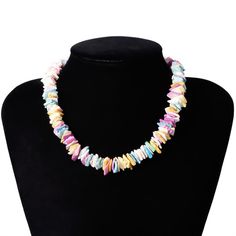 Strung on a 38 cm chain, this colorful piece is made up of different clam chip fragments painted with a mix of pastel colors. Each piece is set in either a lovely pink, ocean blue, golden yellow, or pearly white, or another beautiful pastel shade. Each piece is jaded and unique, making the entire necklace give off a natural appeal. This Innovato Design necklace ends with a stainless steel lobster claw clasp and a 7 cm extender link chain. The extender chain allows the wearer to adjust the length of the necklace.  Product Highlights    Made from natural clam chips  Multicolor Pastel Design  Durable lock and clasp Multicolor Shell-shaped Necklaces For Beach, Multicolor Shell-shaped Necklace For Beach, Adjustable Multicolor Shell Jewelry, Shell-shaped Colorful Bead Necklaces For Gifts, Multicolor Shell Necklaces With Colorful Beads, Multicolor Shell Shaped Beaded Necklaces, Multicolor Shell-shaped Necklace For Gift, Multicolor Shell Jewelry For Gifts, Multicolor Shell Necklace As A Gift