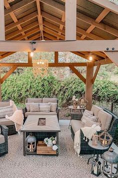 an outdoor living area with furniture and lights