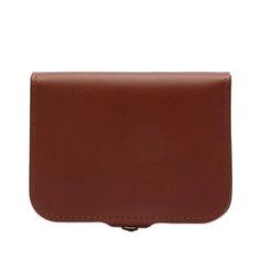 Protect your essentials with ease in the sophisticated yet understated A.P.C. Josh Wallet. Crafted from premium vegetable tanned calfskin leather that will become uniquely yours with every year of use, this box-like wallet safely secures your loose change in addition to offering ample storage for five cards. Enjoy the warmth and natural texture this handsome chestnut-colored material will take on over time. With press stud closure and minimalist silhouette, the A.P.C. Josh Wallet is a timeless accessory that will complement any outfit while maintaining essential organization on-the-go. Minimalist Silhouette, Loose Change, Chestnut Color, You Loose, Men's Bags, Timeless Accessories, Change In, Press Studs, Personal Shopping