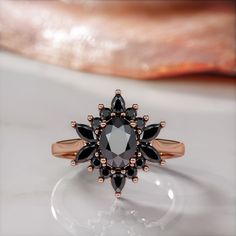 🖤Setting Total Carat Weight: 1.8 Carats 14K Rose Gold Certificate Of Authenticity Included 🖤Main Diamond: Shape: Oval Weight: 1 Carats Color: Fancy Black Clarity: Opaque Color Origin: Enhanced Color Distribution: Even Grade: AAA Measurements: mm Stock ID: 🖤Accent Diamonds Shape: Round & Marquise & Pear Weight: 0.8 Carats Color: Black Clarity: Opaque Color Origin: Enhanced Color Distribution: Even Grade: AAA Stock ID: Notes: 🖤All diamonds are natural, earth-mined diamonds that were suitable f Diamond Alternative Engagement Ring, Black Diamond Earrings Studs, Black Diamond Necklace, Black Diamond Studs, Gold Certificate, White Diamond Earrings, Black Diamond Earrings, Ring Cluster, Marriage Party