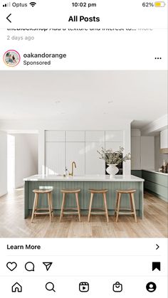 an image of a kitchen with two stools in front of the island and one on the other side