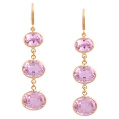 Tresor Beautiful Earring feature 13.645 carats of Kunzite. The Earring is an ode to the luxurious yet classic beauty with sparkly gemstones and feminine hues. Their contemporary and modern design make them perfect and versatile to be worn at any occasion. Classic Oval Earrings With Gemstone Accents, Fine Jewelry Oval Earrings With High Luster, Oval Gemstone Accented Earrings For Formal Occasions, Oval Earrings With Gemstone Accents For Formal Occasions, Elegant Oval Gemstones With Accents, Luxury High Luster Oval Earrings, Luxury Gemstone Drop Earrings, Luxury Oval Gemstone Earrings, Luxury Gold-tone Evening Earrings