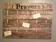 a wooden sign with notes pinned to it that says,'prayers'on them