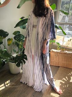 A beautiful handcrafted unisex kimono long robe dress by the hand tie-dye Removable waist tie closure Side slits at hem 100% Soft Rayon Hand wash in cold water, hang dry. Wear on the beach when on the vacation as well home Sizes: One size -One size fit all (Very oversized) Chest & Hip: 66 inches. Length: 54 inches. 🧍🏻‍♂️Tan: Model height is 188cm/6.2ft, (37-31-34") 🧍🏽‍♀️Ginger: Model height is 158cm/5.2ft, American small size (31-25-33") - Each piece is handmade, and due to the nature of Hippie Beach Cover-up Dress With Kimono Sleeves, Flowy Beach Dress With Kimono Sleeves, Oversized Summer Dress With Kimono Sleeves, Oversized Dress With Kimono Sleeves For Summer, White Bohemian Maxi Kimono, White Bohemian Maxi Length Kimono, Wrap Maxi Dress For Beach Cover-up In Spring, Spring Wrap Maxi Dress For Beach Cover-up, Flowy Open Front Festival Dresses