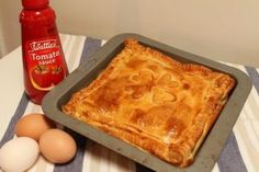 an apple pie and eggs on a table