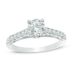 a white gold engagement ring with diamonds on it