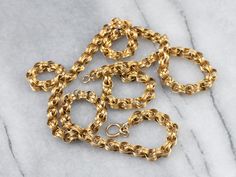 Dating to the late 1800s or early 1900s, this antique chain is detailed with formed, ribbon-like links. The craftsmanship is superb, each link forming a tiny work of art. The style is very gothic and would be suitable for a man or a woman, perfect alone or worn with a pendant. Metal: 14K Yellow GoldWidth of Chain: 5.0 mmLength of Chain: 24 InchesMarks: "14KT" Stamped on the clasp Necklace Antique, Link Chain Necklace, Early 1900s, Chain Link Necklace, Estate Jewelry, Link Chain, Antique Gold, Chains Necklace, Gold Chains