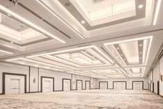 an empty room with white walls and ceilings