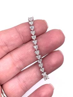 Elevate your wrist game with our exquisite 6 CTW Heart Lab-Grown Diamond Bracelet in 14K White Gold. Featuring stunning VS clarity, F color diamonds, this piece exudes elegance and sophistication. Perfect for adding a touch of luxury to any outfit, it's a statement piece you'll cherish forever. Treat yourself or a loved one to this sparkling beauty today! Customization is our specialty! As direct gemstone and diamond brokers, along with being jewelry designers, we're thrilled to offer personaliz Elegant Heart Cut Diamond Bracelet, White Gold Diamond Heart Bracelet For Wedding, White Gold Diamond Heart Bracelet For Anniversary, Heart-shaped Diamond Bracelet For Wedding, Heart Cut White Gold Diamond Wedding Bracelet, White Gold Heart Cut Bracelet, Elegant Diamond Heart Bracelet With Brilliant Cut, White Gold Heart Cut Diamond Wedding Bracelet, Formal White Gold Heart Bracelet With Cubic Zirconia