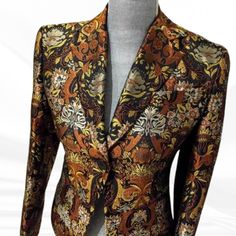 Elevate your wardrobe with this rare Richard Tyler brocade blazer, a stunning silk gold jacquard piece that radiates luxury and sophistication. Perfect for making a statement at any event, this vintage designer blazer is not just a garment but a true reflection of timeless elegance--grab yours today and let your style shine! Rare Find! Beautiful silk metallic brocade blazer by designer Richard Tyler 'Collection' Brown and gold silk jacquard blazer Shoulders are lightly padded, the sleeves are fi Luxury Jacquard Blazer For Work, Luxury Jacquard Blazer For Workwear, Jacquard Party Blazer, Jacquard Long Sleeve Blazer For Parties, Jacquard Long Sleeve Party Blazer, Tailored Jacquard Suits, Tailored Jacquard Suits With Long Sleeve, Elegant Jacquard Blazer For Party, Formal Gold Silk Outerwear