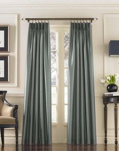 the curtains in this living room are lined with satin