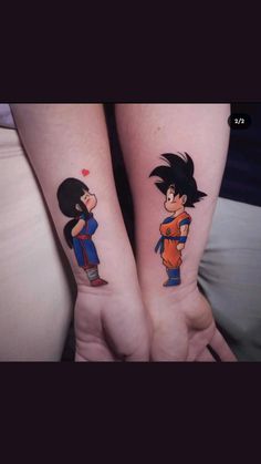 two people with tattoos on their arms, one is holding the other's hand