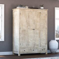 a large wooden cabinet sitting next to a window