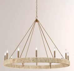 a large chandelier with six lights hanging from it's center circle and rope wrapped around the edges