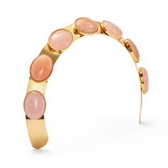 Indulge in ultimate luxury with the Kaia Crown. This exquisite piece features stunning pink opal and aventurine pink semi precious gemstone cabochons, framed by a delicate metal crown. Elevate any outfit with its sophisticated style and add a touch of elegance to your look. Made in NYC. All Archive Sale Items are final sale. No exchanges, price adjustments or returns. Luxury Pink Jeweled Jewelry, Elegant Pink Opal Oval Jewelry, Elegant Pink Opal Jewelry For Formal Occasions, Luxury Crown-shaped Jewelry For Parties, Luxury Crown Shaped Jewelry For Parties, Elegant Formal Pink Opal Jewelry, Elegant Oval Cabochon Jewelry With Natural Stones, Luxury Pink Cabochon Jewelry, Elegant Gold Jewelry With Pink Opal