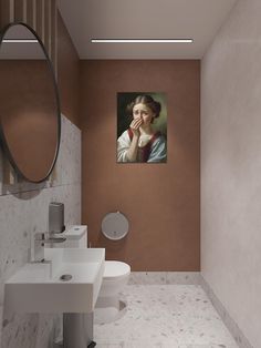 a bathroom with two sinks, a toilet and a painting on the wall above it