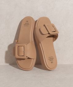 The Daisy Single Buckle Slide from Oasis Society will elevate any ensemble. With its distinct square-toe silhouette and single buckle accent, it brings a touch of individuality and sophistication to your wardrobe. These slides are more than just shoes, they are a statement of high-end fashion. Slide silhouette Buckle embellishment Closure: Slip On Width: Regular Man-made Upper Man-made Insole Rubber outsole Shaft Height: - The front platform approx. 0.75" Circumference of shoe opening: - Bottom Women Footwear Casual, Sleepers Footwear For Women, Footwear For Women, Platform Flats, The Oasis, Dog Boutique, Flying Monkey Jeans, Mad Dog, Casual Shoe