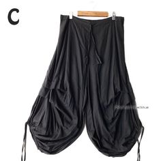 Deformed Aladdin pants with a unique irregular drape design sewn on the side of the knee. Highly breathable soft cotton (with lining), string and back rubber. The smooth and fluffy drape of the soft material is light. Material ： Cotton100% Color ： Black Measurements  Length :  ９０ｃｍ（３５．４'） Waist :   ６０ｃｍ～１１０ｃｍ（２３．６'～４３．３'） ＊Usual price ＄３９ 【 SHIPPING & DELIVERY 】 International Register  Air Mail to all over the world. The estimated delivery time will be approximately 1-4 weeks. (US 5days ~ We wil Bohemian Black Bottoms For Festival, Black Stretch Bohemian Harem Pants, Stretch Black Harem Pants For Festivals, Black Bohemian Harem Pants With Loose Fit, Bohemian Black Harem Pants For Festivals, Summer Pants With Pockets And Asymmetrical Hem, Black Bohemian Bottoms For Festivals, Black Harem Pants For Spring Festival, Bohemian Cotton Bottoms With Asymmetrical Hem