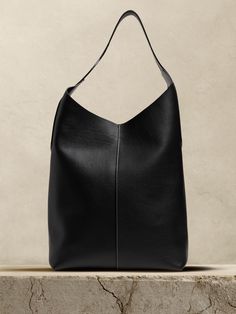 We reimagined our signature Vida Tote bag, opting here for a softer, pebbled leather we sourced from Italy to create a slouchy shape that's perfectly at-ease.  Clasp closure.  Made in Los Angeles, California.  Height: 14" Width: 13" Depth: 6" Canvas Bag Design, Fall Handbags, Pocket Books, Black Leather Bags, Spring 2023, Chic Accessories, Los Angeles California, Pebbled Leather, Aesthetic Clothes