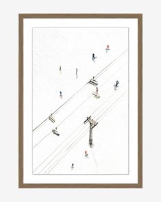 an aerial view of skiers skiing down a ski slope, with power lines in the background