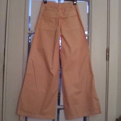 Brand-New And Unworn!!! 100% Cotton, Light Peach-Colored, Wide-Legged Cargo Pants. Leg Can Be Folded And Tied For Short Fit Or Worn Full-Length. Back And Front Pockets With Second Set Front Cargo Pockets On Leg With Tie. Low-Wasted, Seem Down Front Length Of Each Leg. Stretch Waste At Back Allows For Some Give, Slim Fit Down To Hip With Extra Room In Seat And Crotch Area. Zip And Button Closure. Casual, Fun, Stylish! *Buttonhole Needs To Be Sewn At Front. Light Peach Color, Light Peach, Extra Room, Cargo Pants, Pant Jumpsuit, Full Length, Wide Leg, Slim Fit, Brand New