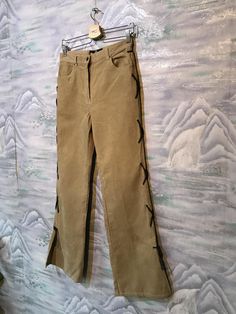 "Baggy Corduroy Pants Corduroy Trousers Boyfriend Pants Brown Sand Corduroy Pants Cowboy style pants Small Size Pants Label size: W32 ; L27 Measurements: (lying flat): Waist: 14\"- 35 cm Hips: 19\"- 48 cm Pant leg inseam: 31,5\" - 80cm Length: 41,5\" - 105 cm Please check measurements to insure a proper fit. Remember to allow yourself some extra room for movement. You can compare these with something from your closet that fits you well. This pants will come to you freshly laundered and ready to Casual Velvet Bottoms For Spring, Casual Straight Leg Velvet Pants, Casual Velvet Straight Leg Pants, Vintage Corduroy Trousers, Straight Leg Corduroy Pants For Spring, Trendy Straight Leg Corduroy Pants, Vintage Straight Leg Corduroy Pants, Beige Straight Leg Corduroy Bottoms, Beige Straight Leg Corduroy Pants