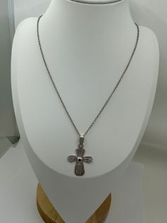 A Divine Fusion: Cross and Garnet Embrace the divine with our Argentium Silver Cross Pendant adorned with a small, precious Garnet. This pendant is a harmonious blend of faith and elegance, meticulously crafted to resonate with those seeking spiritual connection and refined style. The deep red hue of the Garnet beautifully complements the radiant silver, creating a captivating focal point. Key Features: Handcrafted with 925 Argentium Silver for enduring quality and shine. Small Garnet gemstone c Spiritual Cross Pendant Necklace For Formal Occasions, Spiritual Crucifix Jewelry For Wedding, Formal Spiritual Crucifix Jewelry, Hallmarked Spiritual Crucifix Jewelry, Spiritual Hallmarked Crucifix Jewelry, Spiritual Cross Necklace For Formal Occasions, Spiritual White Gold Cross Pendant Necklace, Elegant Cross Pendant Necklace With Oxidized Finish, Elegant Oxidized Cross Pendant Necklace