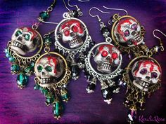 These Dangly Crystal Gothic Skull Chandelier Earrings are made with sparkling crystal beads and hand-painted skulls with rhinestone eyes. The painted dripping blood and antiquing makes this pair super scary!  Love these for an everyday Gothic or Dark style.  They're fun to wear and make a statement.  Available with Posts, Clip-Ons or French Wires. -3 1/2" Long x 1" Wide -0.4 oz. ea. Metal Finishes Available: -Bronze -Silver Colors Available: -Black Cat -Witchy Purple -Spooky Green -Blood Red *Co Bohemian Jewelry For Halloween Party, Bohemian Halloween Party Jewelry, Nickel-free Skull Jewelry For Party, Skull Jewelry For Day Of The Dead Party, Gothic Skull Print Earrings As Gift, Skull Shaped Jewelry For Day Of The Dead Party, Fantasy Halloween Dangle Earrings, Gothic Skull Print Earrings For Gift, Adjustable Gothic Skull Earrings