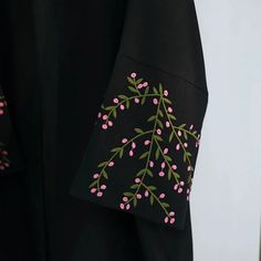 This open abaya is trending now and we know why! An stylish open abaya embroidered with green vines with budding pink flowers on the sleeves, a low shoulder shrug stitching, stunning colors, breathable linen blend fabric, and button closures to take this from an open abaya to a closed abaya! Style up or down for an effortlessly classy look. Available in 2 colors and 5 sizes. Shrug Stitching, New Abaya Design, Abaya Embroidery, Abaya Ideas, Embroidery Abaya, Closed Abaya, Abaya Styles, Embroidered Abaya, Shoulder Shrug