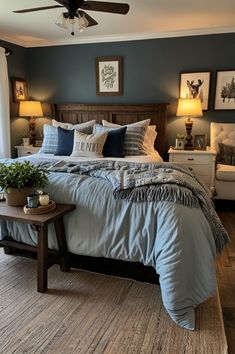 a bedroom with blue walls and white bedding