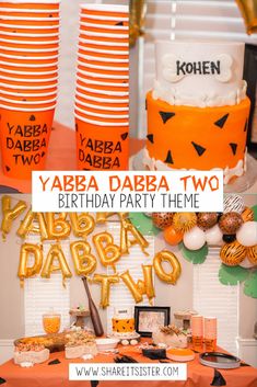 a birthday party with orange and black decorations