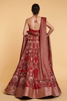 Red and gold 14 kali lehenga with thread jaal, floral thread and crystal window pattern embroidery with aari and crystal border. Comes with stripe work blouse with crystal highlights and dangler tassels belt, thread work dupatta and a net dupatta with stripe work.
Component: 5
Pattern: Embroidered
Type Of Work: Floral Jaal Pattern, Crystals, Aari, Thread Work
Neckline: Plunged V-Neck
Sleeve Type: Sleeveless
Fabric: Lehenga, Blouse, Belt; Dupion Silk; Dupatta 1: Net; Dupatta 2: Tinsil Georgette
C Aari Thread Work, Kali Lehenga, Window Pattern, Lehenga Dupatta, Tassel Belt, Lehenga Blouse, Dupion Silk, Pattern Embroidery, Net Dupatta