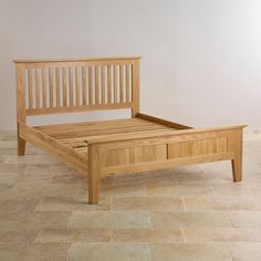 a wooden bed frame with two drawers on the bottom and one drawer at the foot