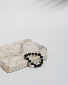 Channel confidence, enhance protection, and support the LGBTQIA+ community with this gorgeous Onyx PRIDE Mala bracelet. 10% of all PRIDE bracelet sales are donated to The Trevor Project which provides mental health resources to LGBTQIA+ youth and teenagers. Thank you for your support! To find your size: Hold your arm with your hand relaxed and fingers gently outstretched. With your other hand, wrap a soft measuring tape around your wrist where you would like to wear the bracelet - don't pull it Spiritual Black Hypoallergenic Bracelets, Spiritual Hypoallergenic Black Bracelets, Hypoallergenic Black Spiritual Bracelets, Hypoallergenic Black Beaded Bracelets For Healing, Hypoallergenic Black Bracelets For Meditation, Adjustable Black Holistic Bracelets, Spiritual Black Wristband For Everyday, Black Holistic Beaded Bracelets, Holistic Black Bracelets With Round Beads