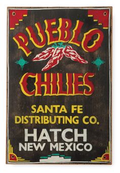 a sign that says pueblo chilis santa fe distributing co hatch new mexico on it