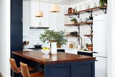 the kitchen is clean and ready to be used as a dining room or office space