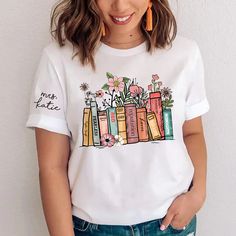 Flower Books Shirt, Gift For Book Lover, Gift For Bookworms, Teacher Gift TH T-Shirt Made from airy fabric, can be worn all year around, good sweat absorbing, wear at home, good sleepwear, or any sports activities. Great as Birthday gifts, any Holiday presents for loved ones or It's a gift to yourself. This adorable item can be designed upon anyone's wish with any title. Product details: Brand: Gildan Classic unisex cut makes this easy to fit the body. Material: Cotton Heavyweight Fabric. Sport Merch Shirt, Fun Music, Fan Fashion, Book Tshirts, Tour Merch, Taylor Swift Album, Gifts For Bookworms, Book Shirts, Gift For Music Lover