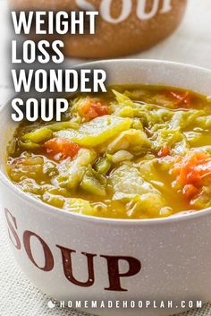 a white bowl filled with soup on top of a table