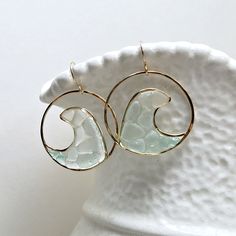 "Made to order. Important information on current production times may be found on the shop policies page or in the shop announcement. One of the newest additions to my sea glass and resin hoop earring line: for the bohemian beach babe. The sea glass has been gathered from beaches across the Hawaiian islands. The first six pictures are in gold filled, and the last two are in sterling silver. ~ sea glass, resin ~ gold filled, sterling silver, or rose gold filled wire ~ approximately 1 1/2 inches ( Summer Gift Circular Jewelry, White Circular Jewelry For The Beach, Everyday Glass Jewelry For Summer, Unique Round Earrings For Beach, Modern Glass Jewelry For Summer, Modern Gold Jewelry For The Beach, Unique Beach Glass Jewelry, Glass Hoop Earrings Gift, Unique Glass Jewelry For Beach