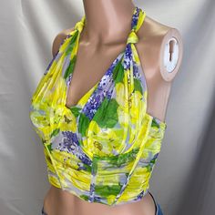 This Top Wraps Around Neck That Falls Asymmetrical In Back. Bright Neon, Yellow, With Shades Of Purple Lavender And Green. There Is Double Fabric On The Bust Area. Boning Down The Sides In Front And Along The Cup Area. The Bottom Stretches For A Pull Over Fit. Please Ask If You Have Any Questions. Yellow Crop Top With Built-in Bra, Green Spaghetti Strap Halter Top For Spring, Green Halter Neck Camisole For Summer, Yellow Tank Top With Built-in Bra For Spring, Green Fitted Halter Top With Spaghetti Straps, Fitted Green Halter Top With Spaghetti Straps, Yellow Tank Top With Built-in Bra For Summer, Yellow Stretch Top With Built-in Bra, Yellow Sleeveless Crop Top With Built-in Bra