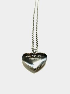 "The Stainless steel heart locket captures your love story in a polished and timeless way. Beautifully engraved with your unique message, it makes a heartfelt gift for your wedding day or special anniversary. With a stainless steel construction and lobster clasp closure, this locket will last forever. Pendant with chain length: 45cm/18\" + 5cm/2\". Weight:5g **No refunds for customized items unless the order was damaged in shipping or has an error. **We do not refund shipping charges or pay for Heart Shaped Locket Necklace With Polished Finish For Anniversary, Personalized Silver Heart Necklace In Stainless Steel, Elegant Engraved Stainless Steel Heart Necklace, Silver Stainless Steel Heart Necklace For Gift, Silver Stainless Steel Heart Necklace Gift, Engraved Double Heart Locket Necklace For Anniversary, Engraved Silver Locket Necklace For Anniversary, Heart Shaped Locket Necklace With Polished Finish As Gift, Stainless Steel Heart Necklace For Anniversary