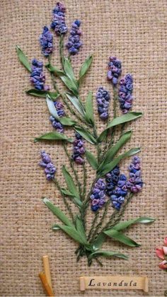 flowers and gardening tools are laid out on a burlap background with the words lavender written below them