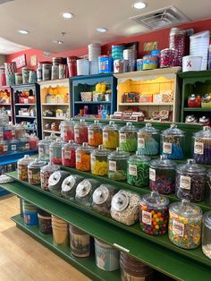 a store filled with lots of different types of candies and candy in plastic containers