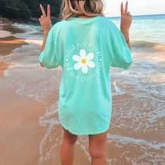 "Introducing our Comfort Colors T-Shirt featuring a delightful daisy graphic and the uplifting message, \"What is for you will not pass you.\" This unique design combines style, comfort, and a positive affirmation to brighten your day and inspire you to embrace life's journey. Crafted from 100% ring-spun cotton, this T-shirt offers a soft, breathable, and durable fabric that will keep you comfortable throughout the day. The unisex sizing ensures a relaxed fit for both men and women, making it a versatile choice for anyone seeking comfort and style. Not only does this T-shirt make a fashion statement with its cute daisy graphic, but it also carries a powerful message. \"What is for you will not pass you\" serves as a gentle reminder to trust in the natural flow of life and have faith that w