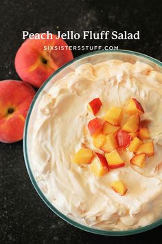 two peaches and some whipped cream in a bowl