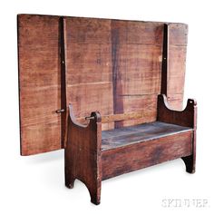 an old wooden bench sitting in front of a white wall with wood slats on it