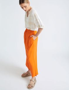 Introducing the KATIES Women's High-Rise Regular Pants in a stunning shade of orange. These pants are designed to elevate your style with their sophisticated and chic look. The high-rise waist provides a flattering fit, while the seven-eighth length adds a touch of modernity. Perfect for any occasion, these versatile pants can be dressed down for a casual day out or dressed-up for a more formal event. Step out in confidence and make a fashion statement with these eye-catching pants. KATIES - Womens Pants - Orange Summer Wide Leg - Linen - Casual Fashion Trousers - Solid - High Waist - Full Length - Work Clothes - Office Wear Our Brands Autograph Beme Katies Liz Jordan Millers Noni B Rivers Rockmans Rsports W.Lane Quick Links Shop By Style Visit our Store Never Miss a Deal Add to Favourites Orange Wide-leg Pants For Summer, Trendy Orange Wide-leg Pants, Orange Wide-leg Summer Pants, Orange Wide-leg Pants With Elastic Waistband, Luxury Orange Wide-leg Pants, Fashion Trousers, Versatile Pants, Linen Casual, Womens Pants